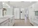 Bright kitchen featuring white cabinets, tile floors, stainless steel appliances, and modern fixtures at 8350 Monarch Cir, Seminole, FL 33772