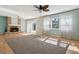 Spacious living room with brick fireplace, ceiling fan, and lots of natural light at 8350 Monarch Cir, Seminole, FL 33772