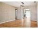 Spacious living room with hardwood floors, transitional lighting, fireplace and french doors at 8350 Monarch Cir, Seminole, FL 33772