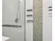 Shower features modern fixtures, mosaic tile accents, and a glass door at 8350 Monarch Cir, Seminole, FL 33772