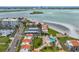 Beautiful aerial view of beachfront condos with a pool and lush landscaping with beach access at 865 S Gulfview Blvd # 306, Clearwater Beach, FL 33767