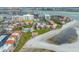 Aerial view of a beachfront complex with a pool, beach access, and city views at 865 S Gulfview Blvd # 306, Clearwater Beach, FL 33767