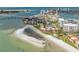 Expansive aerial view of waterfront condos, a sandy beach, and a bridge to the city skyline at 865 S Gulfview Blvd # 306, Clearwater Beach, FL 33767