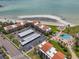 Beautiful aerial view of beachfront condos with private parking and close beach access at 865 S Gulfview Blvd # 306, Clearwater Beach, FL 33767
