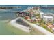 Great aerial view showcases beachfront condos, beach access, and nearby coastal waters at 865 S Gulfview Blvd # 306, Clearwater Beach, FL 33767