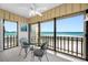 Charming sunroom with bistro table and stunning beach views at 865 S Gulfview Blvd # 306, Clearwater Beach, FL 33767