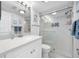 Clean bathroom offers a walk-in shower with glass doors and a sleek vanity at 865 S Gulfview Blvd # 306, Clearwater Beach, FL 33767