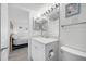 Well-lit bathroom with a sleek single vanity and tiled walk-in shower at 865 S Gulfview Blvd # 306, Clearwater Beach, FL 33767