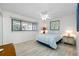 Cozy bedroom with neutral paint, tile floors, and a ceiling fan at 865 S Gulfview Blvd # 306, Clearwater Beach, FL 33767