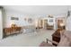 Bright living room featuring comfortable seating and adjacent dining area at 865 S Gulfview Blvd # 306, Clearwater Beach, FL 33767
