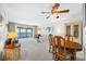 Bright living room with ocean views that opens to a dining area at 865 S Gulfview Blvd # 306, Clearwater Beach, FL 33767