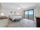 Bright bedroom with water view and sliding glass door access at 865 S Gulfview Blvd # 306, Clearwater Beach, FL 33767