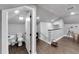 Finished attic space with wood-look floors, small bathroom, and a staircase to another level at 9019 S County Line Rd, Lithia, FL 33547