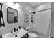 Bright bathroom featuring a stylish black framed mirror and a white subway tile shower at 9019 S County Line Rd, Lithia, FL 33547