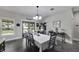 Open dining room with lots of light and an elegant chandelier at 9019 S County Line Rd, Lithia, FL 33547