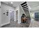Welcoming entryway with a modern staircase and an adorable piano at 9019 S County Line Rd, Lithia, FL 33547