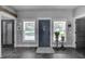 Entryway with decorative door, plants, stylish decor, and a glimpse into adjoining rooms at 9019 S County Line Rd, Lithia, FL 33547