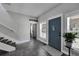 Open foyer with staircase, decorative front door, stylish decor and lots of natural light at 9019 S County Line Rd, Lithia, FL 33547