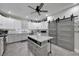 Contemporary kitchen featuring white cabinets, granite countertops, and a center island at 9019 S County Line Rd, Lithia, FL 33547