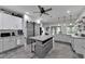 Spacious, modern kitchen with gray cabinets, granite countertops, stainless steel appliances, and a central island at 9019 S County Line Rd, Lithia, FL 33547