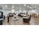 Spacious living room includes reclining furniture, hardwood floors, and recessed lights at 9019 S County Line Rd, Lithia, FL 33547