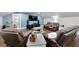 Cozy media room with comfortable leather recliners, a large flat-screen TV, and built-in shelving at 9019 S County Line Rd, Lithia, FL 33547