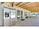 Large covered patio with refrigerator, ceiling fan and views of the property at 9019 S County Line Rd, Lithia, FL 33547