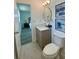 A stylish bathroom featuring a modern vanity, updated fixtures, and marble-style floors at 9308 45Th N St, Pinellas Park, FL 33782