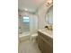 A stylish bathroom featuring updated fixtures, marble-style tile, and a modern vanity at 9308 45Th N St, Pinellas Park, FL 33782