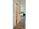 A peek into the light-filled bedroom featuring wood laminate floors and neutral decor at 9308 45Th N St, Pinellas Park, FL 33782