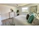 Serene bedroom features a comfortable bed, a ceiling fan, and decorative accents at 9308 45Th N St, Pinellas Park, FL 33782