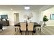 Well-lit dining area with a modern chandelier and stylish decor at 9308 45Th N St, Pinellas Park, FL 33782