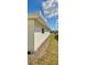 View of the clean white stucco exterior and lawn of this home with a neatly kept lawn at 9308 45Th N St, Pinellas Park, FL 33782