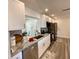 Modern kitchen boasts granite countertops, stainless steel appliances, and ample cabinet space at 9308 45Th N St, Pinellas Park, FL 33782