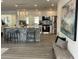 Modern kitchen with stainless steel appliances, granite countertops, and a breakfast bar island at 9308 45Th N St, Pinellas Park, FL 33782
