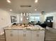 Bright, open-concept living room features a modern kitchen island and elegant decor at 9308 45Th N St, Pinellas Park, FL 33782