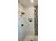 A luxurious shower featuring marble-style tiles, black mosaic accents, and bronze fixtures at 9308 45Th N St, Pinellas Park, FL 33782