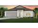 Beautiful single-story home showcasing a well-manicured lawn and a two-car garage at 9753 Redwood Heights Loop, Thonotosassa, FL 33592