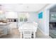 Bright and modern kitchen with a large island, eat-in dining, and natural light at 1208 Bay Pine Blvd, Indian Rocks Beach, FL 33785