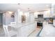 Bright and modern kitchen with a large island, stainless steel appliances, and custom backsplash at 1208 Bay Pine Blvd, Indian Rocks Beach, FL 33785