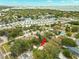 Aerial view showing property's location within a neighborhood near a waterway with community docks at 121 Pennsylvania Ave, Palm Harbor, FL 34683