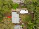 Directly overhead aerial view of the property, highlighting the roof, yard, and surrounding greenery at 121 Pennsylvania Ave, Palm Harbor, FL 34683