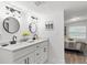 Bright bathroom features dual sinks, sleek fixtures, and modern decorations at 121 Pennsylvania Ave, Palm Harbor, FL 34683