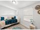 Bright bedroom featuring a daybed with neutral bedding, wood floors, and a sunny window at 121 Pennsylvania Ave, Palm Harbor, FL 34683