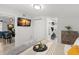 Bright bedroom with a flat screen tv, a ceiling fan, and a modern interior design at 121 Pennsylvania Ave, Palm Harbor, FL 34683