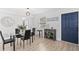Stylish dining area featuring a glass table, black chairs, and modern decor with neutral paint at 121 Pennsylvania Ave, Palm Harbor, FL 34683