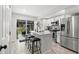 Modern kitchen featuring white cabinets, stainless steel appliances, and an island with seating at 121 Pennsylvania Ave, Palm Harbor, FL 34683