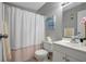 Clean bathroom features shower with curtain, vanity, and neutral colors at 1400 Gandy N Blvd # 1701, St Petersburg, FL 33702
