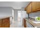 Bright kitchen features white appliances, warm wood cabinets, and plenty of counter space at 1400 Gandy N Blvd # 1701, St Petersburg, FL 33702