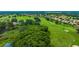 Expansive aerial shot of a well-manicured golf course winding through a residential area at 14174 Thoroughbred Dr, Dade City, FL 33525